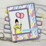 Card of the girl holding balloons with 'HAPPY BIRTHDAY.'