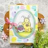 Card of Pooh in bunny ears with a pink bow and pastel egg paper, 'Happy Easter'.
