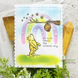 Card with Pooh looking up beneath a pastel rainbow, 'So glad things are looking up'