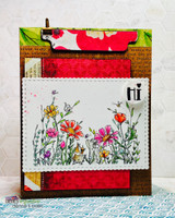 Card with the vivid wildflower meadow and foxes over patchwork papers with a red bloom.