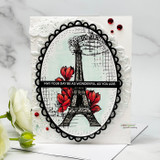Card of the Eiffel Tower framed in an oval with magnolias and a well-wishes sentiment.