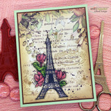 Soft pink card of the Eiffel Tower with magnolias and layered frames.