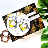 Black-and-gold card with two whiskey glasses and "I'm not saying you're old"