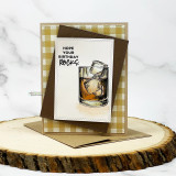 Kraft card with the whiskey glass on gingham paper and "Hope your birthday rocks"