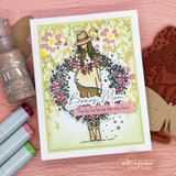 Card with a girl in a hat carrying a huge bouquet, stamped 'Bonus Mom' and 'Thanks for being the very best'.
