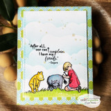 Soft blue card of Pooh, Eeyore and a boy on grass, 'After all one can't complain, I have my friends'