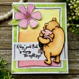 Card with the colored Pooh-and-Piglet hug, a pink blossom and 'A hug, said Pooh, is always the right size.'
