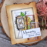 Distressed kraft card with the camera and yellow roses, layered with film-strip die cuts and the forever-close sentiment on a white panel.