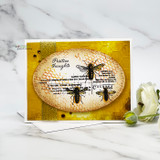 Card with a bee over a golden honeycomb oval, stamped 'Positive thoughts.'