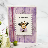 Darling Menagerie card, the sweet baby giraffe, bear and Highland calf grouped inside circle frames on a soft pastel background.