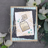 Handmade card with a torn deckle-edge, stitched die-cut frame layered over the design.