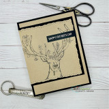Handmade card with a torn deckle-edge, stitched die-cut frame layered over the design.