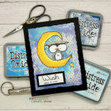 Handmade card with a torn deckle-edge, stitched die-cut frame layered over the design.