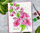 Card with the branch colored in hot pink with green leaves on a white embossed panel, 'You always amaze me' stamped below, matted in pink with watercolor paints alongside.