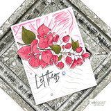 Card with the bougainvillea colored in coral and olive over a pink stamped background, a script sentiment die cut in black at the lower right, photographed on a pressed tin surface.