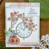Soft card with a clock hanging from a branch of coral blossoms over pink gingham and a 'time to celebrate congratulations' sentiment.