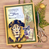 Card with the lion colored over a jungle-toned collage, 'Courage above fear brave enough to take risk'
