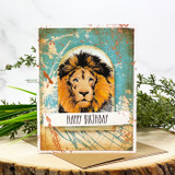 Card with the lion colored gold over a distressed teal panel, 'Happy Birthday'