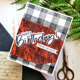 The wrinkle texture stamped in metallic red on a birthday card with a black-and-white plaid corner.