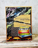 The wrinkle texture in dark rainbow tones behind a stack of books on a layered card.