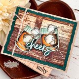 Card with the wood planking stamped in rich brown, two whiskey glasses on ice in the centre and a script cheers greeting, matted in deep teal on a heart shaped tray.