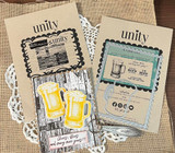Two kraft tags on a burlap and doily background, both stamped with the wood grain texture and finished with Unity labels and a pair of frothy beer mugs.