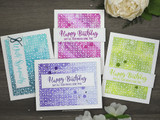 Four small cards in purple, teal and green, each with the tile pattern blended softly behind stamped birthday and sympathy sentiments.