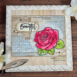 Cream and wood toned card with the tile pattern in pale blue, a hand colored red rose with green leaves and a have a beautiful day label.