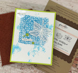 Lime green and white card with the tile pattern in teal and a white embossed butterfly, plus a small a happy hello label.