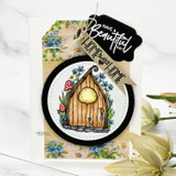 Card with a flower-framed fairy door and a 'Have a Beautiful Day / Home Sweet Home' tag.