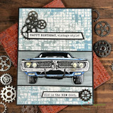 Card with the muscle car colored black over blue grunge paper with gears and 'Old is the new cool.'