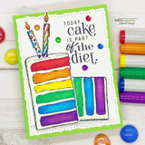 Green-framed white card: the cake slice colored in rainbow layers with candles above “TODAY cake is part of the diet,” markers alongside.