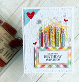 White embossed card with a red heart: a row of rainbow candles above a “COLOR-FULL BIRTHDAY WISHES” banner.