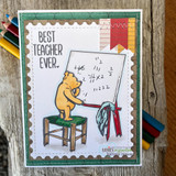Postage-stamp-framed card of the bear at his math easel, captioned "Best teacher ever.", styled with colored pencils.