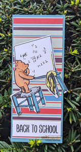 Slimline card of the bear at his math board over striped paper, with "Back to school."