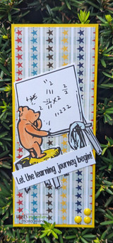 Slimline card of the bear at his board on a star-print panel, with "Let the learning journey begin!"