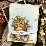 Barrel of fall blooms with pumpkins on a soft sky card, 'sending autumn's embrace, filled with love'.