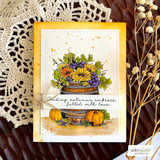 Sunflower barrel on a golden card layered over a doily, autumn embrace sentiment.