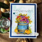 Colorful barrel bouquet on a navy-framed card, 'sending autumn's embrace, filled with love'.