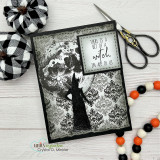Handmade Halloween card in black and white gothic damask with the silhouette of a witch and the sentiment 'There is a bit of a witch in all of us', styled with a buffalo-check pumpkin and orange-and-black beads.