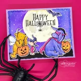 Night-scene card with Pooh, Piglet and a caped Eeyore beside jack-o'-lanterns under a full moon and a 'Happy Halloween' sentiment.