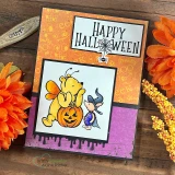 Orange honeycomb Halloween card with Pooh dressed as a bee holding a jack-o'-lantern beside Piglet and 'Happy Halloween'.