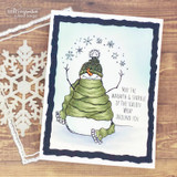 Card with the snowman colored in a green scarf on a black frame and 'May the warmth & sparkle of the season wrap around you.'