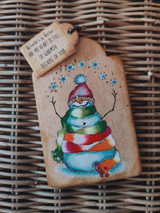 Tag with the striped-scarf snowman and 'Winter's here and my heart is full of warmth because of you.'