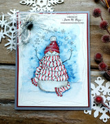 Card with the red-scarf snowman on a snowy blue panel with die-cut snowflakes.