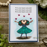 Clean card with the girl in a teal dress, hearts overhead, stamped 'Fill your heart with JOY!'