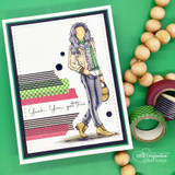 Bold green card with Ava Girl on a black-and-white striped panel beside washi tape rolls.