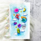 Blue watercolour card with brightly coloured dinosaurs, balloons, clouds and stars around 'RAWR means I love you in dinosaur.'