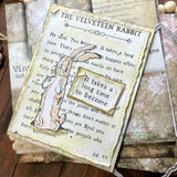 Card with the rabbit on layered vintage book pages with a silver frame.