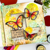 Art journal spread with yellow and teal stamped circles, painted butterflies and a tag reading 'take time to notice all the tiny moments.'